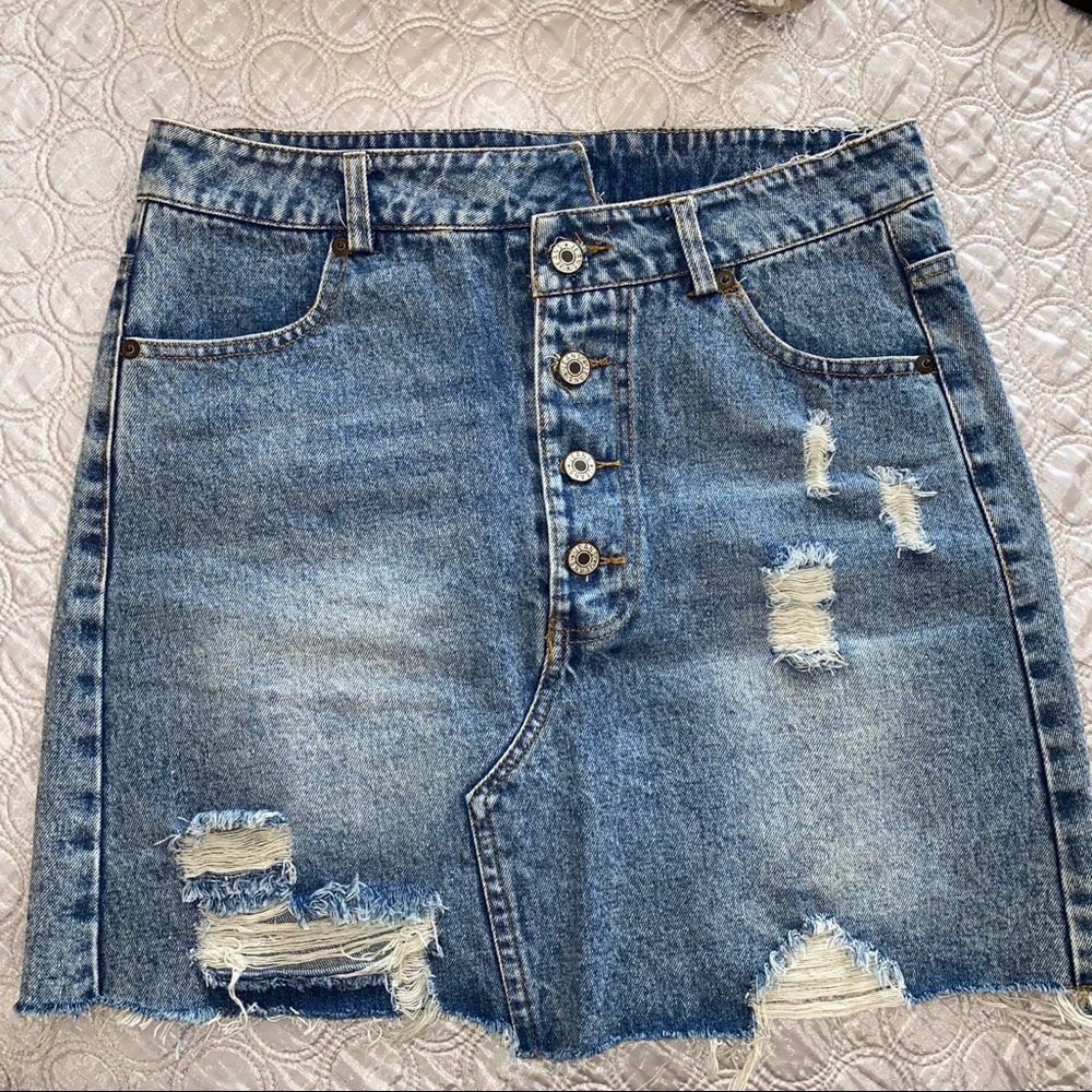 Distressed asymmetrical denim skirt